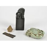 A small group of Chinese carved stone objet d'art, to include a mythical beast on plinth, height