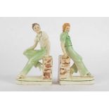 A pair of early 20th Century bookends, taking the form of youthful male and female companions,