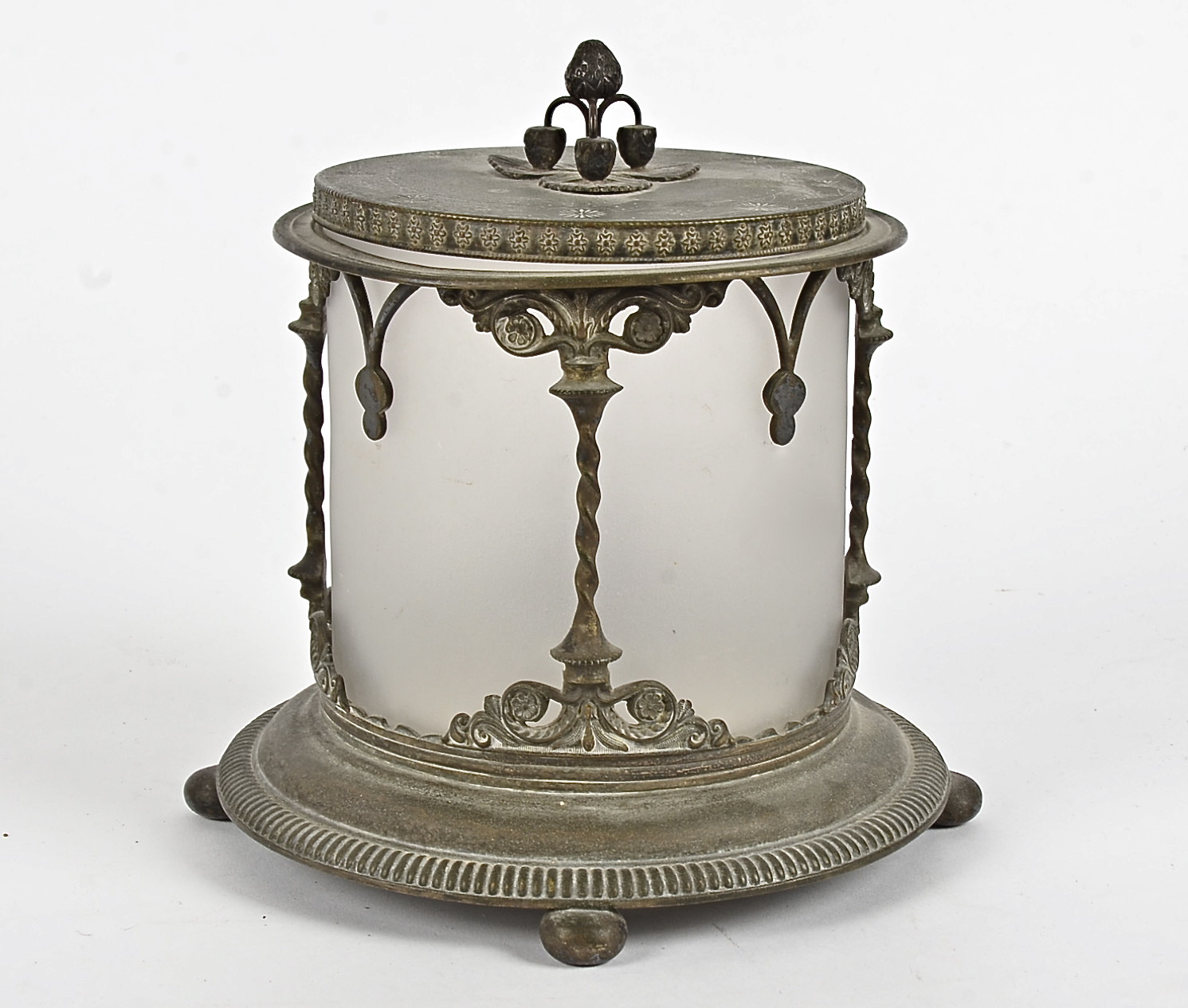 A 20th Century biscuit barrel, set within a with a metal frame with carved decoration of flowers,