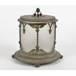 A 20th Century biscuit barrel, set within a with a metal frame with carved decoration of flowers,