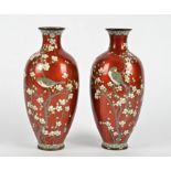 A pair of Japanese cloisonné vases, red ground decorated with birds on floral branches, height 24cm,