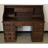 A contemporary mahogany pedestal S shape roll top desk, with one long central drawer to the top,