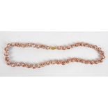 A string of porcelain beads, length 34cm,