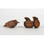 Two Japanese boxwood netsuke, one in the form of a toad holding a coin in its mouth, length approx