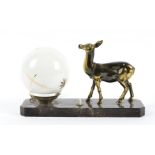 An Art Deco French table lamp, modelled as a standing fawn on a black plinth base next to opaque