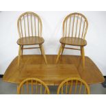 An Ercol blonde extending dining table, 77cm x 150cm, leaf 71cm, height 71cm, with a set of four