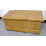 A contemporary pine blanket box, with dovetail body and shaped plinth base, hinged lid, 91cm x