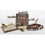 Two marble chess boards, together with a small quantity of chess pieces, but not a full set, a