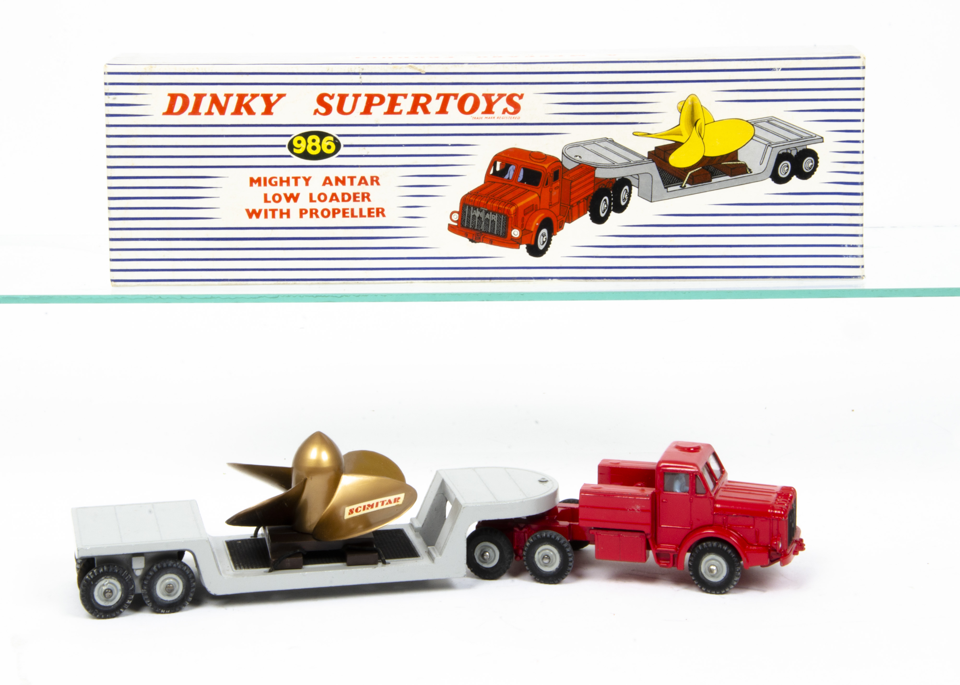 A Dinky Supertoys 986 Mighty Antar Low Loader With Propeller, red cab, blue driver, glazing, grey
