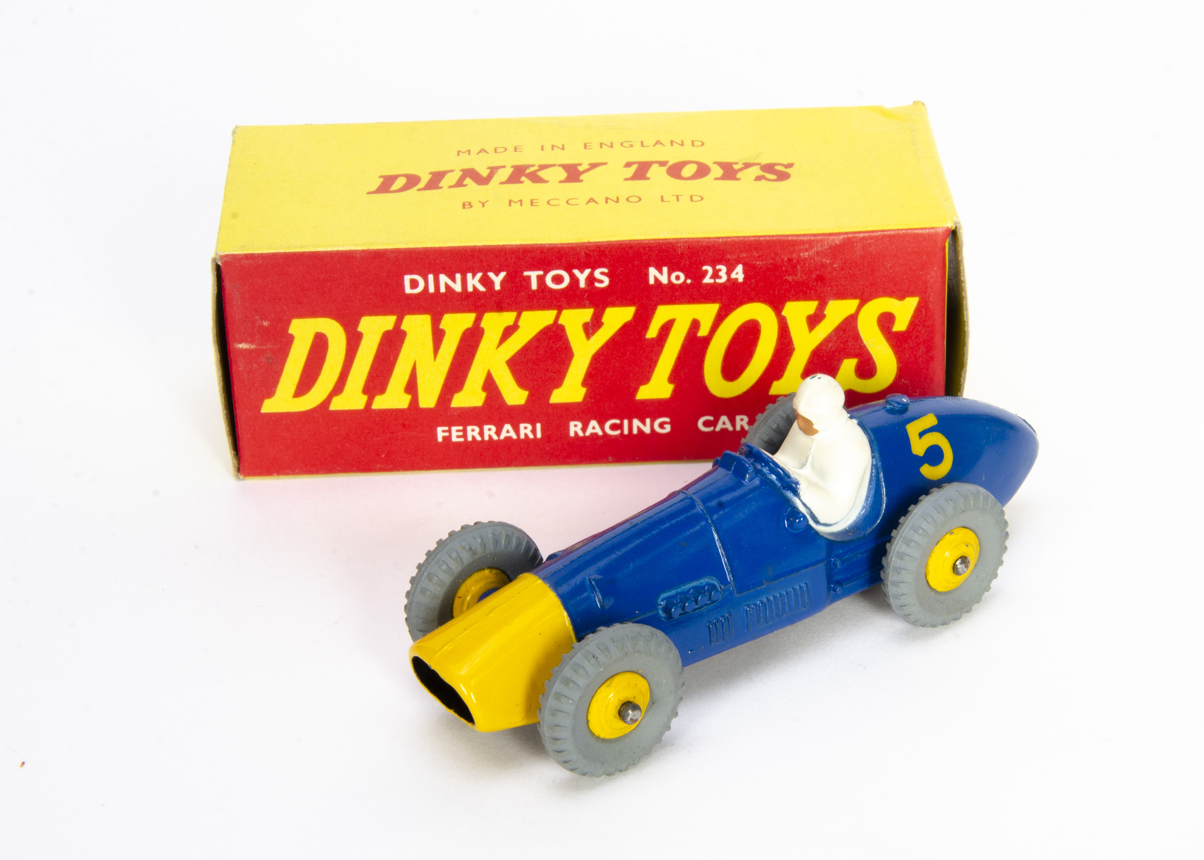 A Dinky Toys 234 Ferrari Racing Car, blue body, yellow nose cone and hubs, white driver, RN5, in