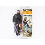 Vintage Palitoy Action Man Adventurer, with brown flocked hair, clothes, equipment manual and star