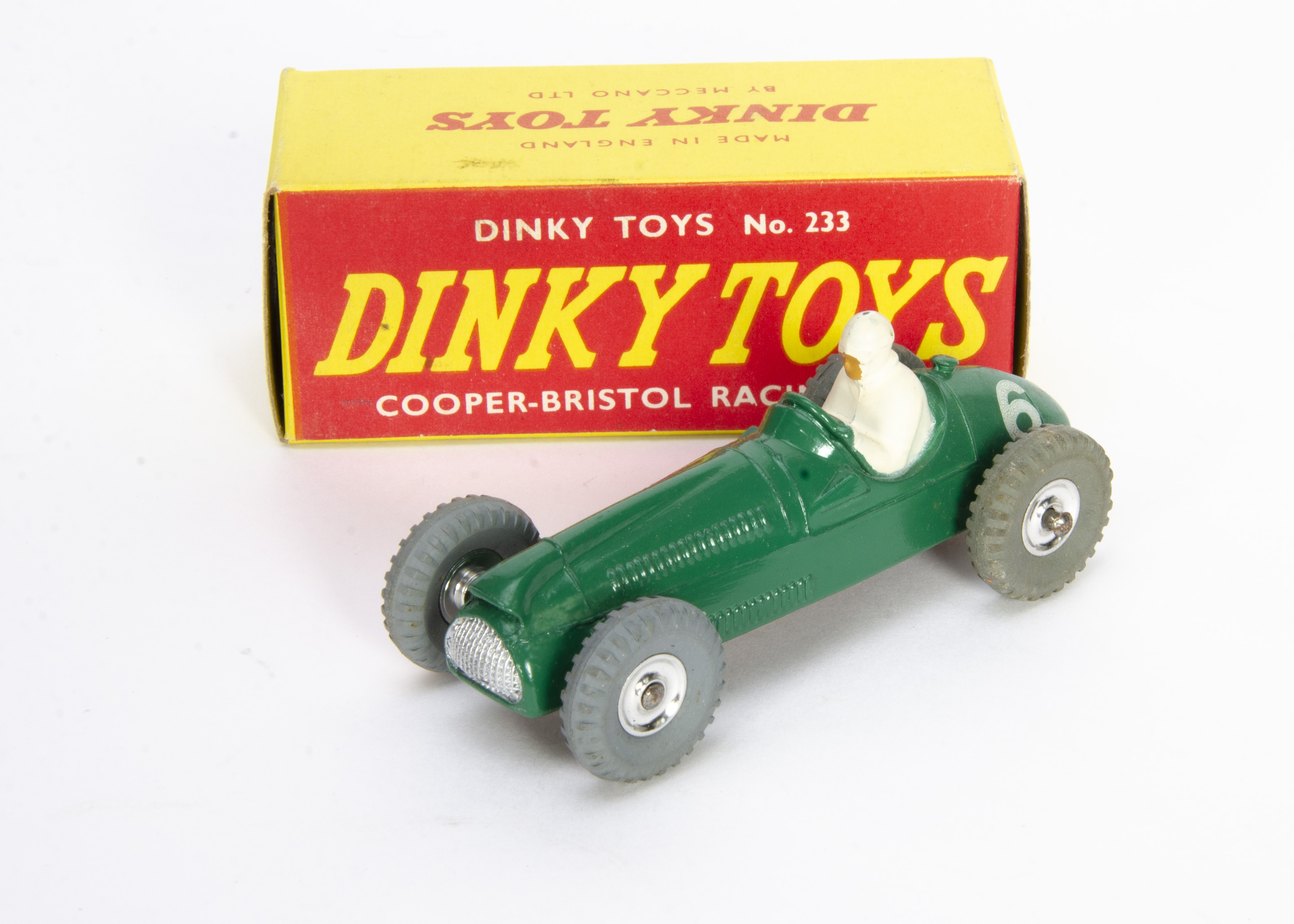 A Dinky Toys 233 Cooper-Bristol Racing Car, green body, white driver, black gloss base, RN6, spun