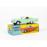 A Corgi Toys 214 Ford Thunderbird Hardtop, pale green body, cream hardtop, ~1959~ rear number plate,