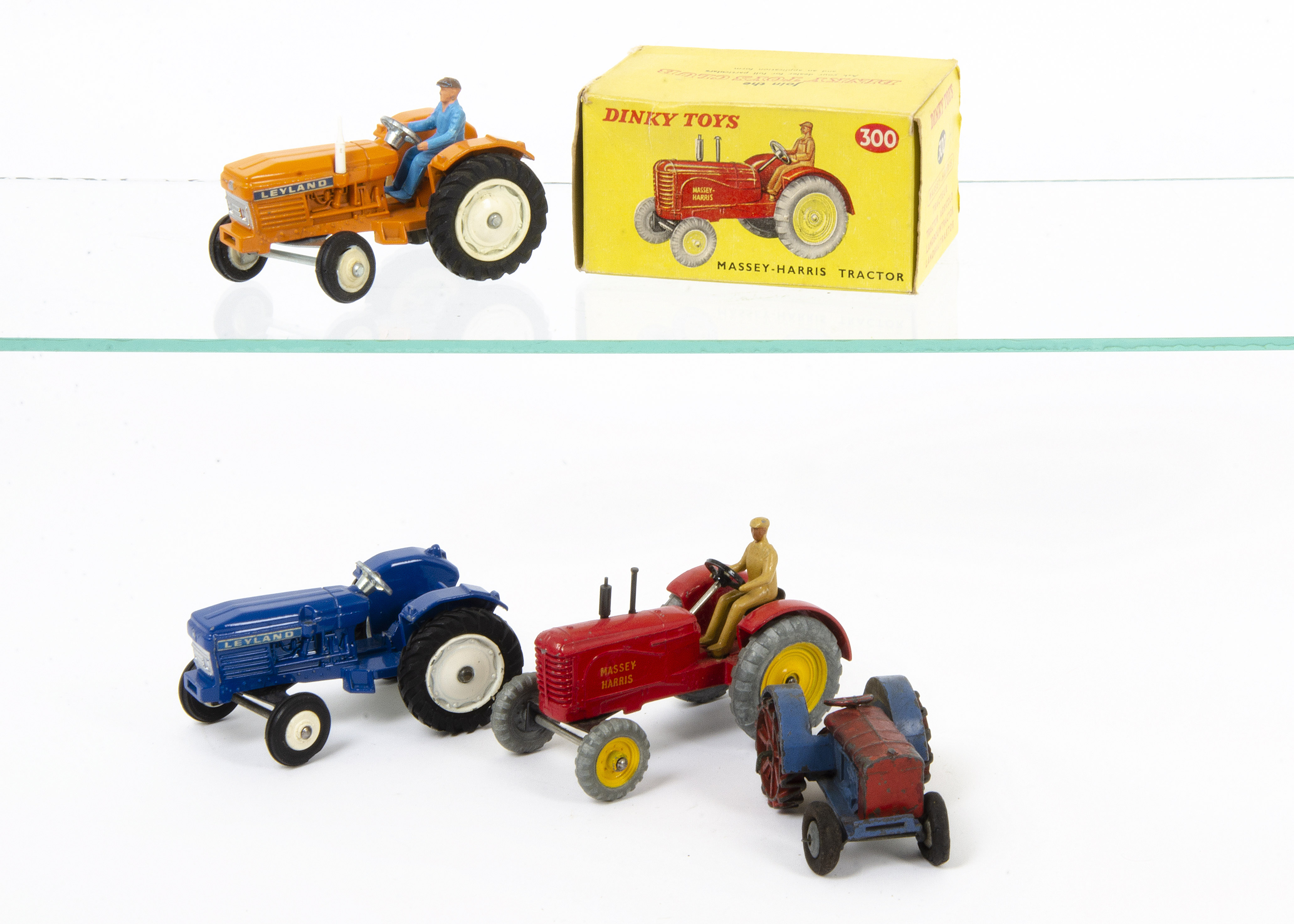 Dinky Toy Tractors, 300 Massey-Harris Tractor, in original box, loose pre-war 22e Farm Tractor,