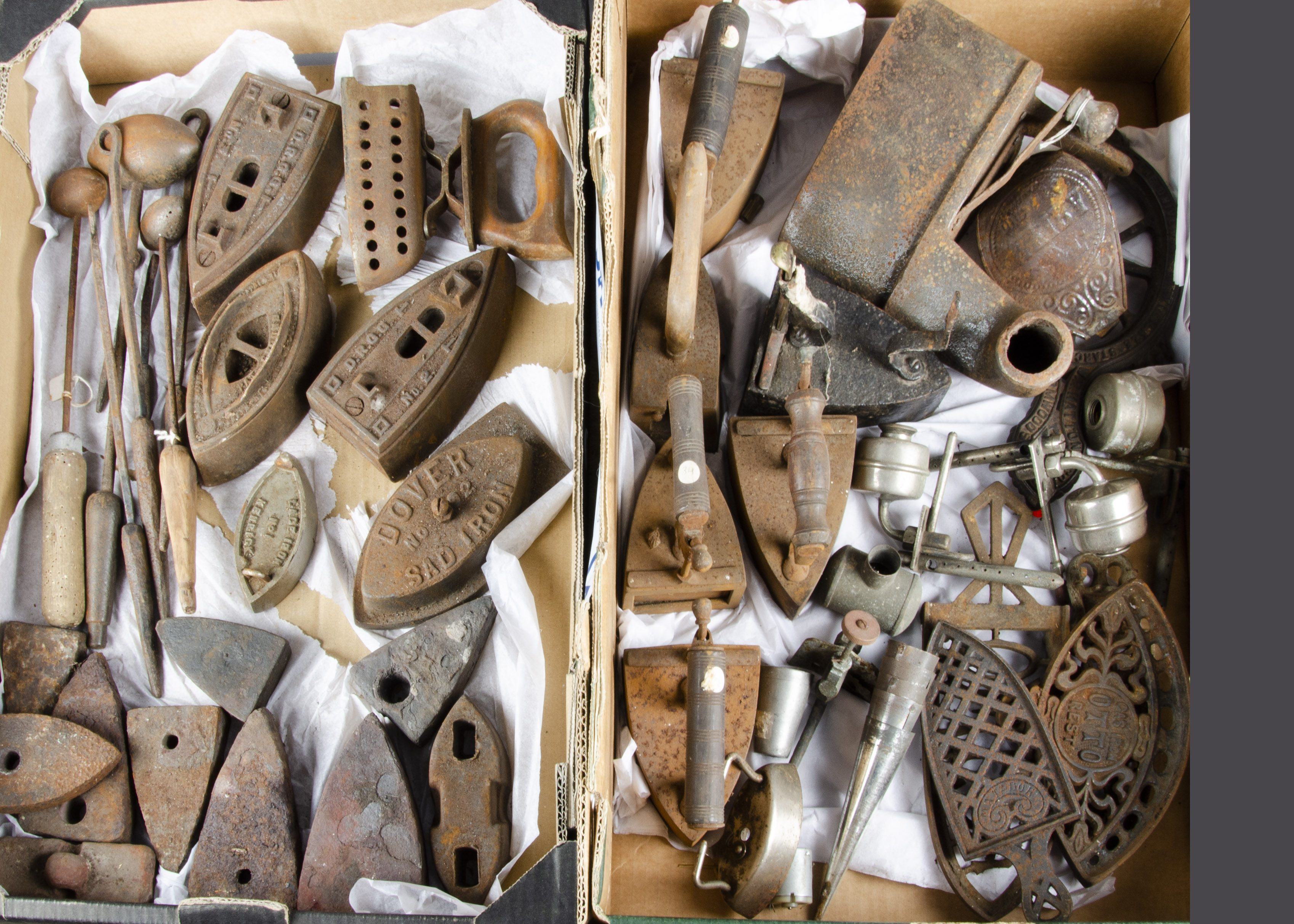 A quantity of irons and spares for restoration, six box irons; a large charcoal iron, egg irons,