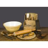 A selection of kitchenalia, including a ‘Want Not’ carved circular breadboard; a mandolin; a spoon