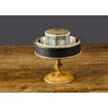 ‘Le Praxinoscope’ optical toy by Emile Reynaud, a mirrored octagonal centre inside a circular tin