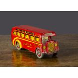 A Wells Brimtoy red Ideal Coach single deck bus, clockwork, red lithographed tinplate with yellow