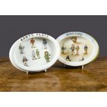 Two Grimwades Brownie Baby Plates, oval, each transfer decorated with Brownies from around the world