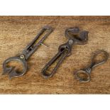 Three pairs of 19th Century Sugar Nips, wrought iron with locking clasp —9¼in. (23.5cm.) longest