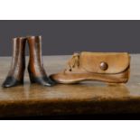 A pair of carved wooden ladies' boots, the lower black stained with nail buttons —2¾in. (7cm.) high;