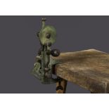 A Moldacot pocket sewing machine, for clamping to a table top —7½in. (19cm.) high (bobbin missing,