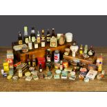 Miniature food and drink packaging, including packets of cigarettes, produce tins, OK sauce,