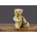A small J K Farnell 1920s teddy bear, with golden mohair, black flat boot button eyes, pronounced