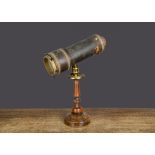 An early Charles G Bush & Co (American) kaleidoscope, card covered in black textured paper, gold