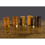 Five 19th Century turned-wood castle dice shakers, various wood with crenellations and five die —3¼