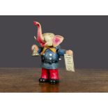 A Kuramochi celluloid clockwork Circus Elephant 1930s, standing with moulded red and blue clothes,