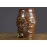 An English salt-glazed stoneware Sherry barrel, with applied Royal Coat of Arms, two knights on