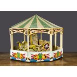 A Kemp’s model Boadicea fairground ride, with cast metal horses and chariot, a bucking bronco