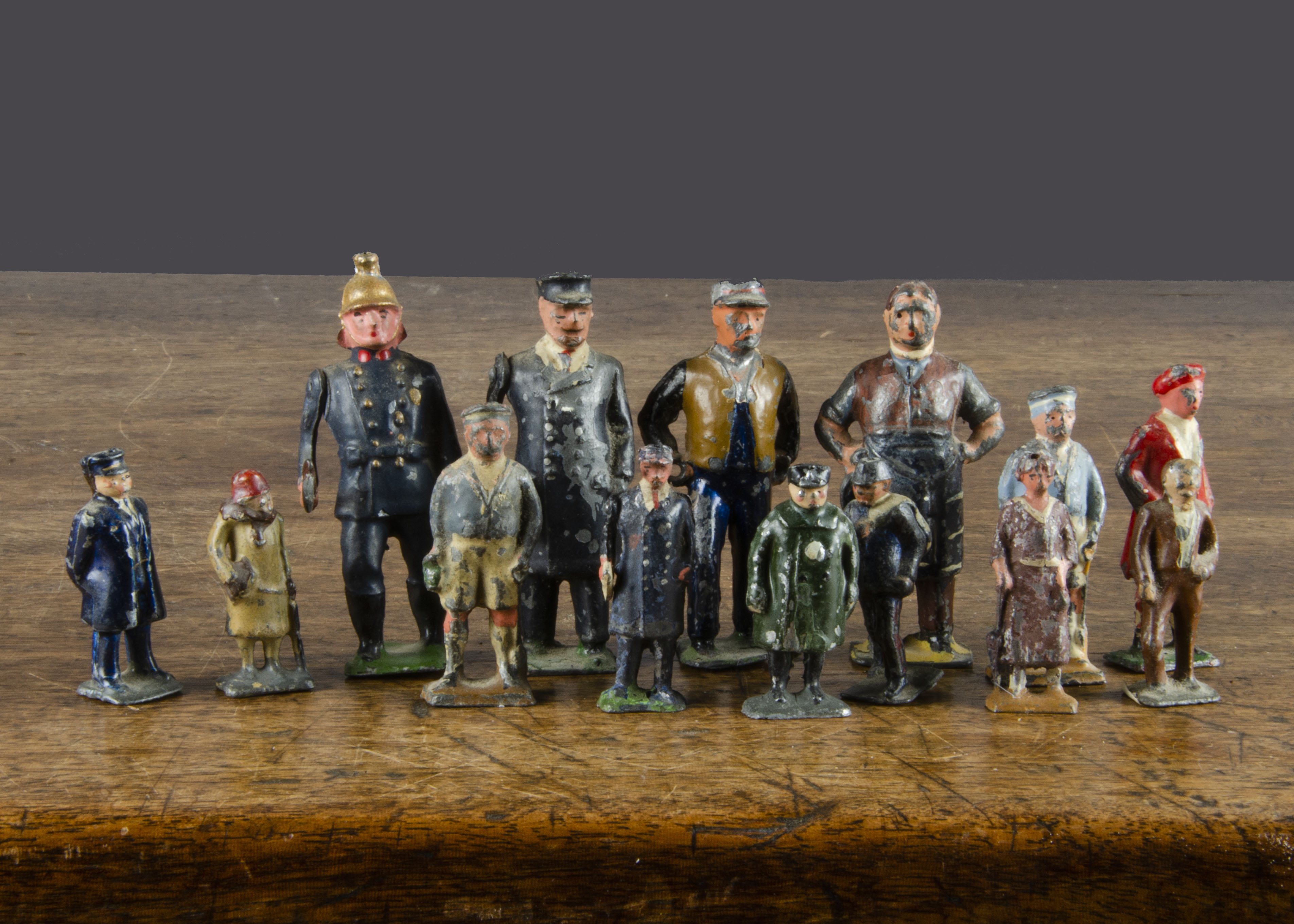 Pixyland Kew pre-WW2 lead railway figures, thirteen gauge 1 including butcher, fireman and four