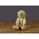 A Farnell ’soldier’ teddy bear, with blonde mohair, bead eyes, swivel head and pin-jointed limbs —