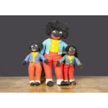 Three post-war Merrythought Golliwogs, Felt with plush hair, plastic googly eyes and yellow