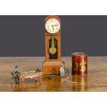 Tinplate novelties, a Penny Toy billard player —4in. (10cm.) long; a Wells long case clock with