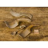 Four treen butter scoops, —7¼in. (18.5cm.) longest; and a tiny heart mould