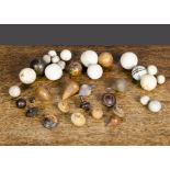 Fourteen miniature turned wooden spinning tops, assorted woods —¾in. (2cm.) smallest; and a quantity