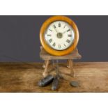 A Post Office wall clock, with wooden circular surround, painted dial with brass hands, weights