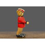 A rare Schuco Soldier Bear Automato circa 1920, with golden mohair head and hands, boot button eyes,