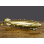 A Tipp & Co British market clockwork tinplate R100 Airship, lithographed silver with blue lining and