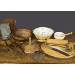 Various kitchenalia, including an oval breadboard, a rolling pin, mortar and pestle, vegetable