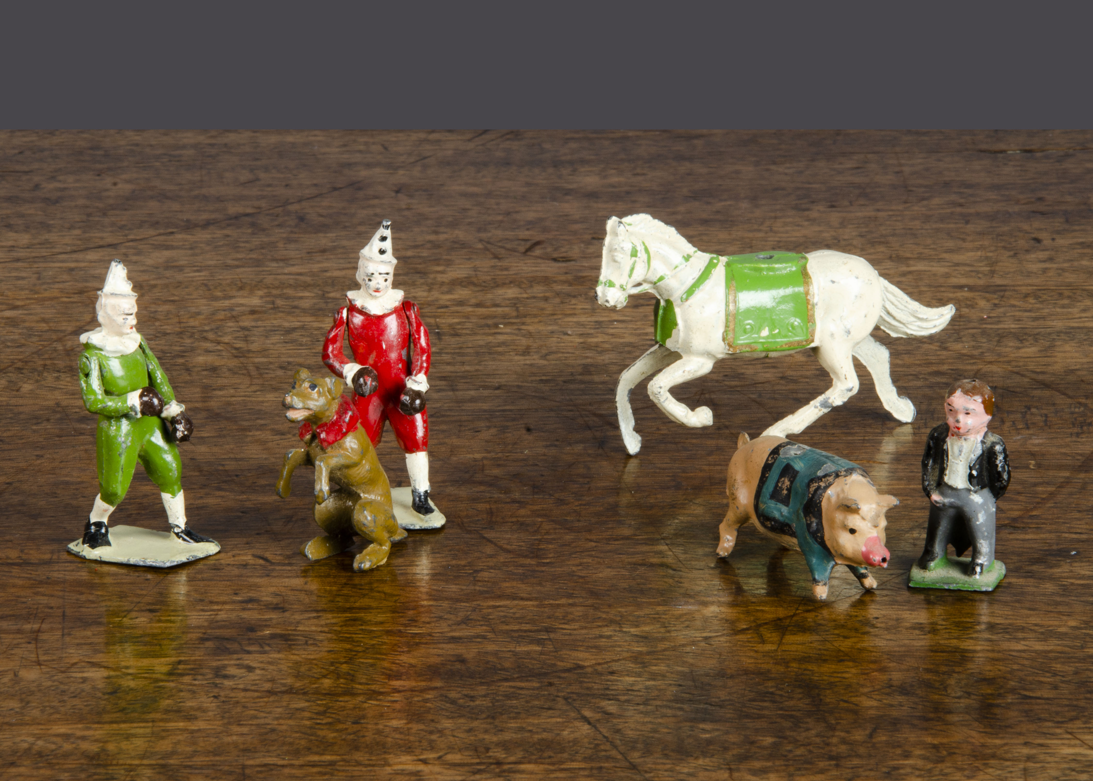 Circus items by Britains and others, including a rare John Hill pig in jacket, Britains tub and