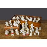 Bisque Snow Baby cake decorations, forty including three moulded holding hands —3½in. (9cm.) long,