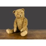 A German cotton plush teddy bear 1940s, dark blonde with orange and black glass eyes, pronounced