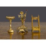 Gilt metal dolls’ house items, an Art Nouveau umbrella stand —3in. (7.5cm.) high; another umbrella