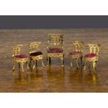 Small-scale gilt metal dolls’ house chairs, a carver with velvet seat —2in. (5cm.) high and four
