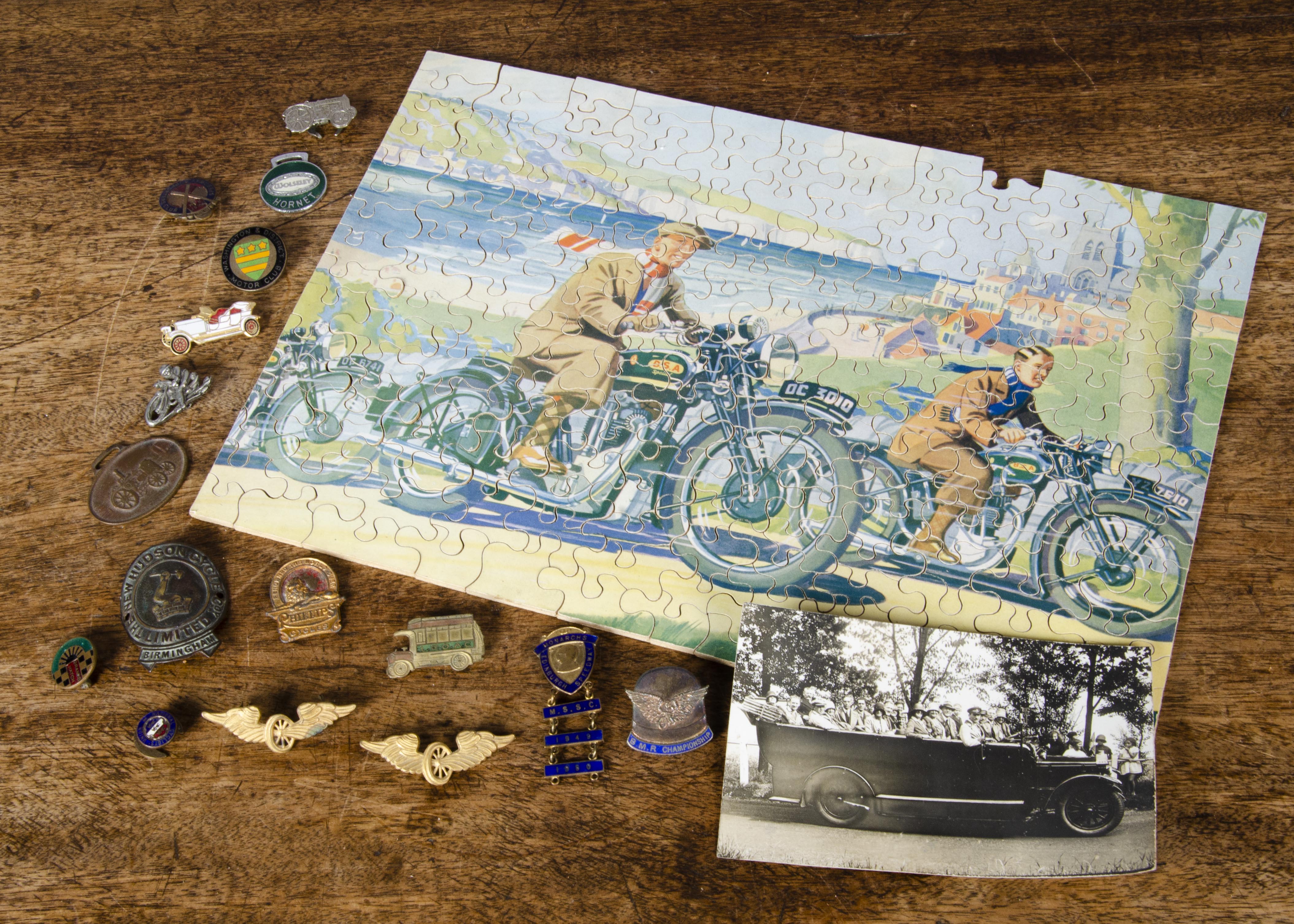 Motor vehicle memorabilia, a wooden jigsaw of BSA motorcycles (piece missing); enamelled badges