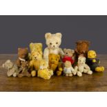 Small and miniature teddy bears, a Berg teddy bear with beige mohair, orange and black glass eyes,